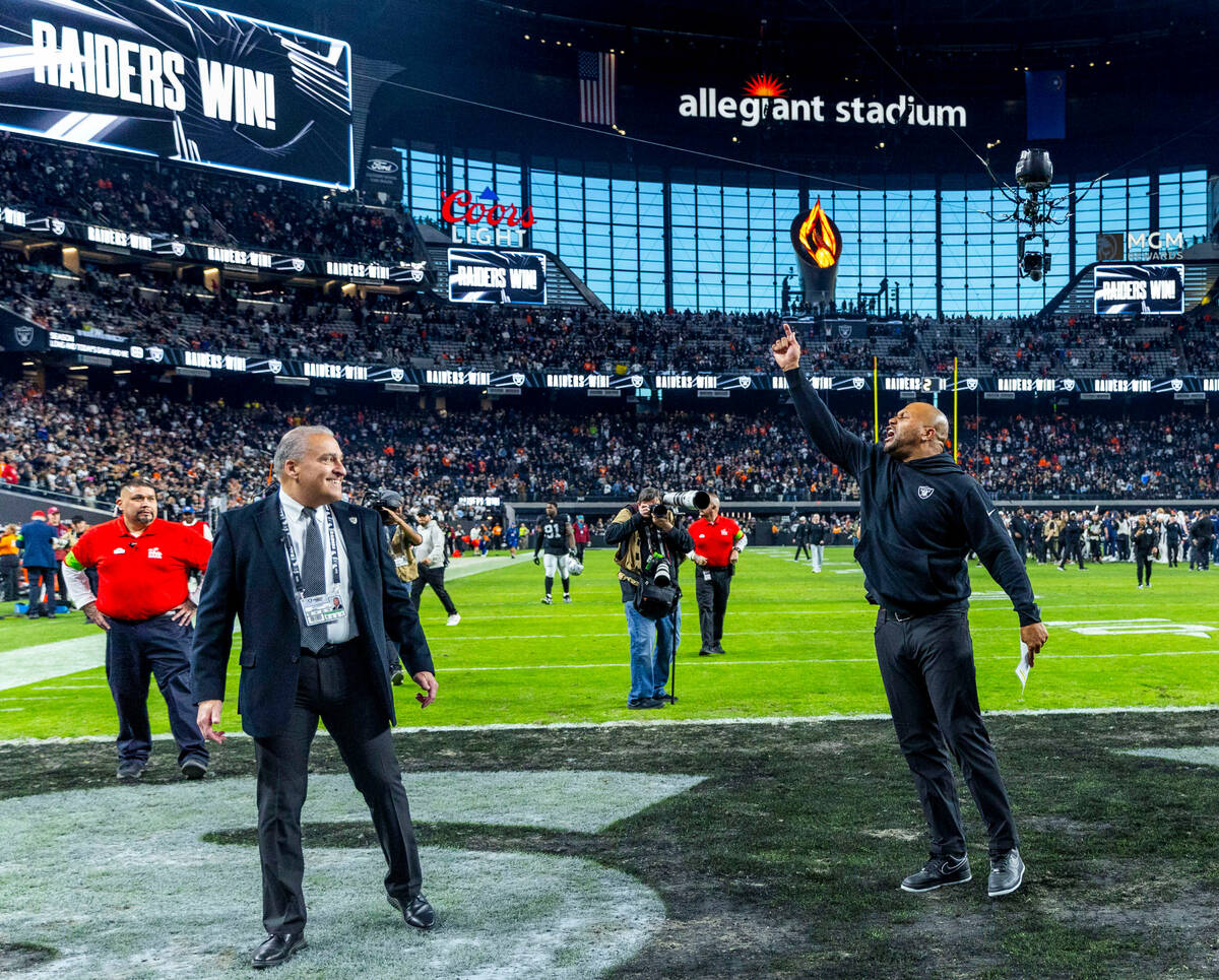 Raiders interim head coach Antonio Pierce responds to cheers by the fans after defeating the De ...