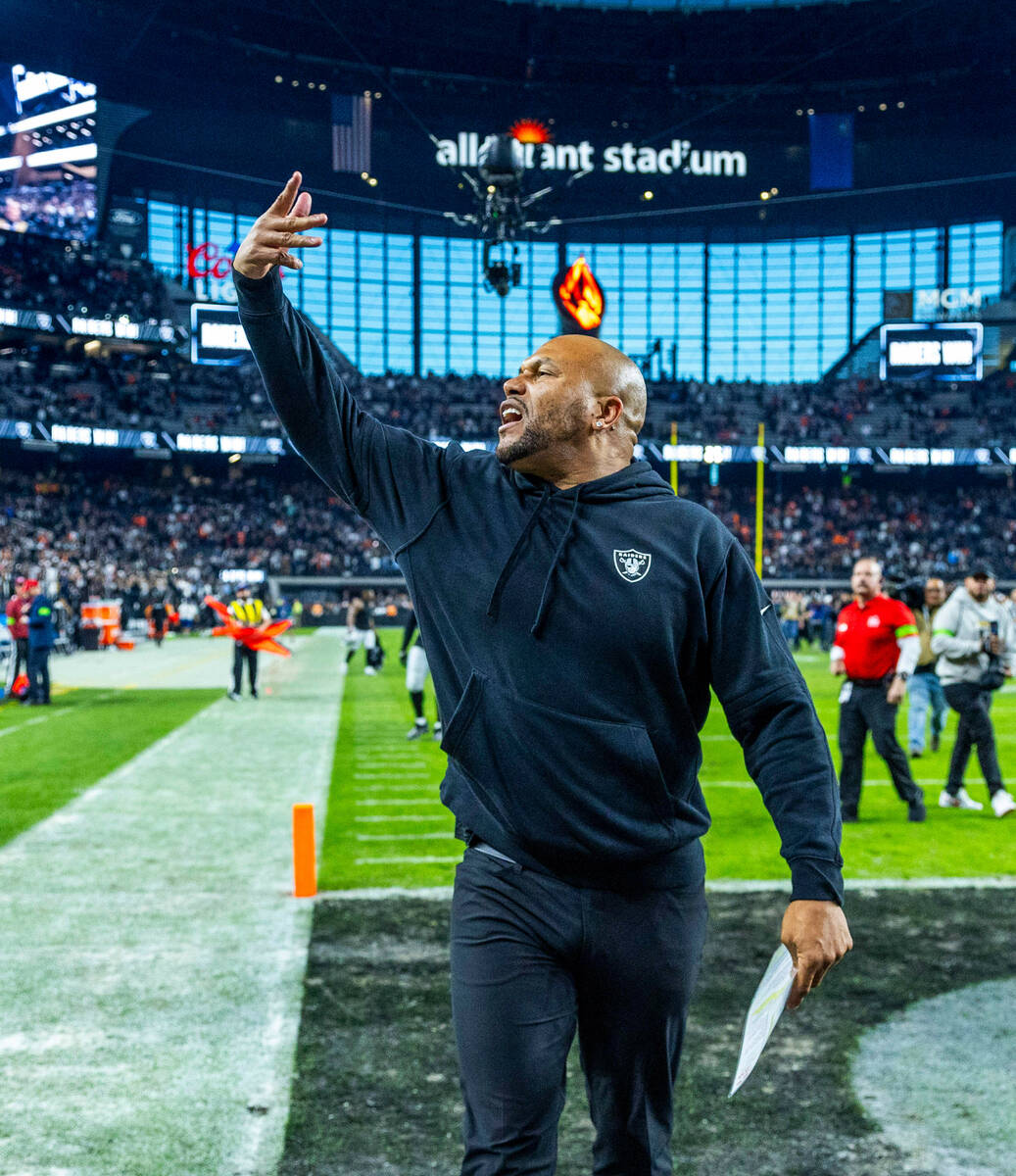 Raiders interim head coach Antonio Pierce responds to cheers by the fans after defeating the De ...