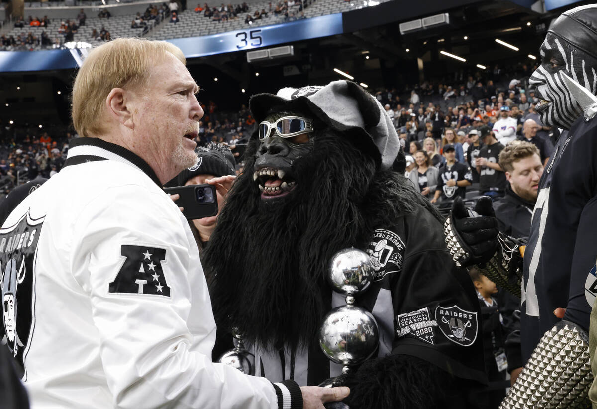 Raiders owner Mark Davis chats with fans prior to the start of an NFL football game between the ...