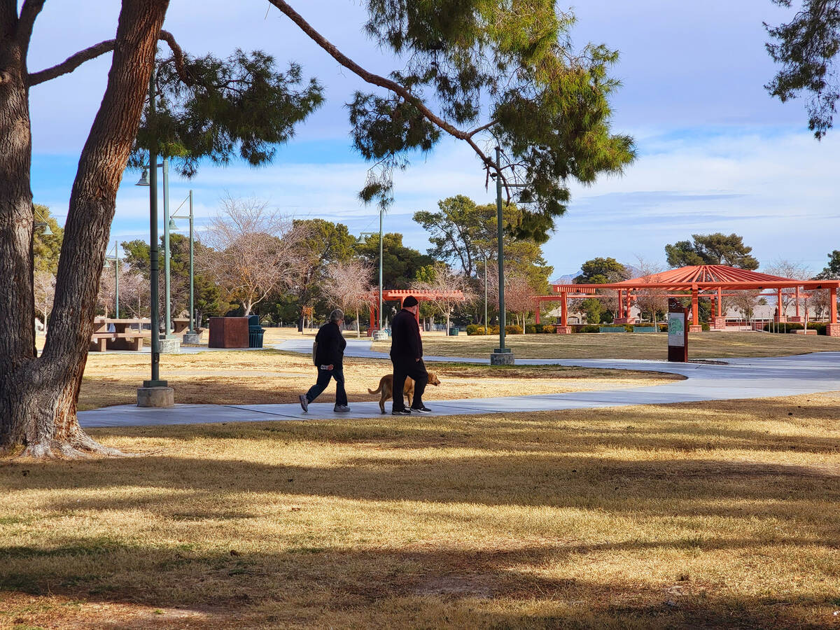 Dog walkers get some exercise on a December day at Craig Ranch Regional Park in North Las Vegas ...