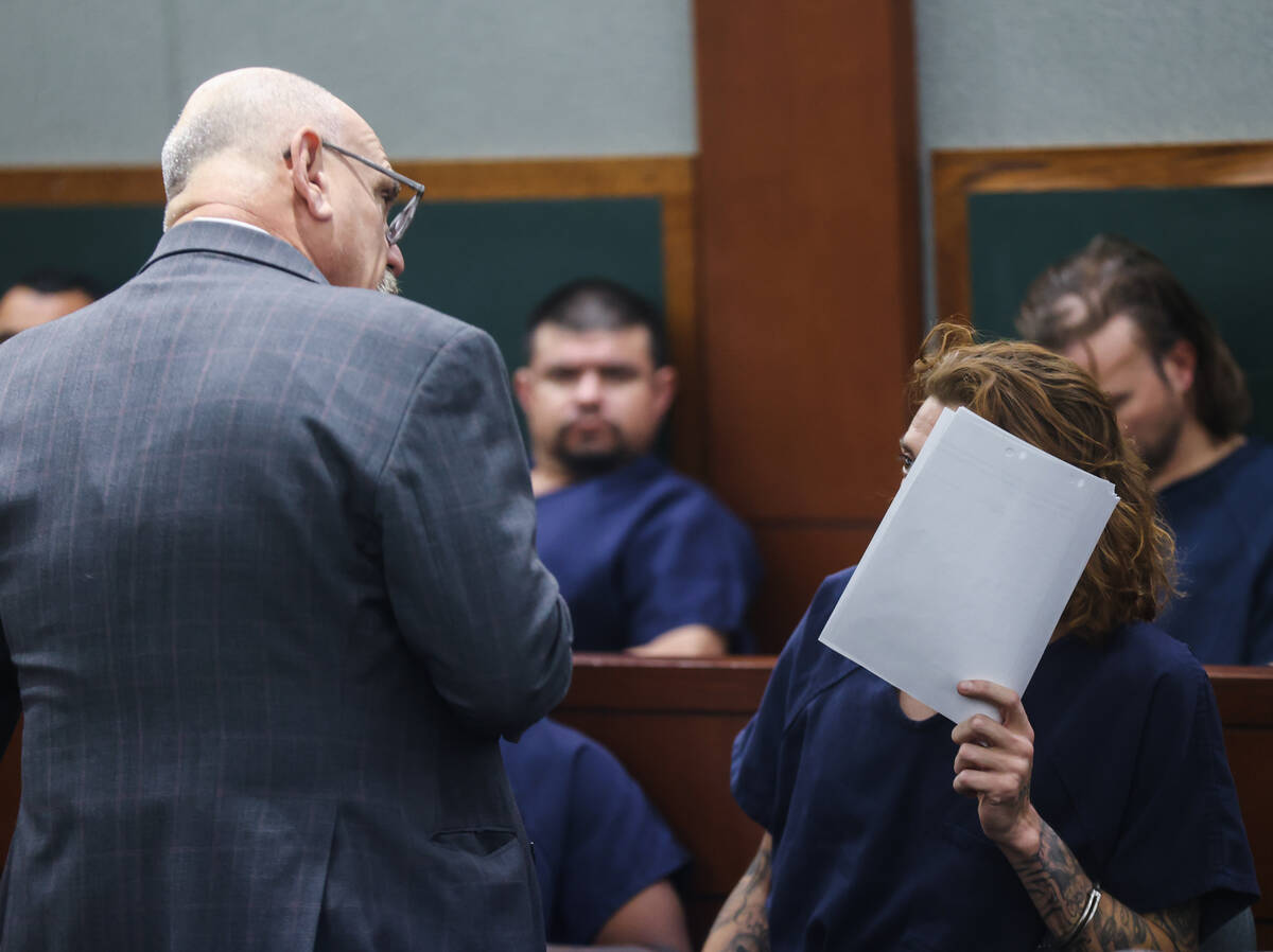 Defense attorney Frank Kocka speaks with his client Cristobal Omar Perez, one of the suspects i ...