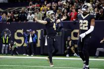 New Orleans Saints quarterback Derek Carr (4) celebrates after a touchdown during an NFL footba ...