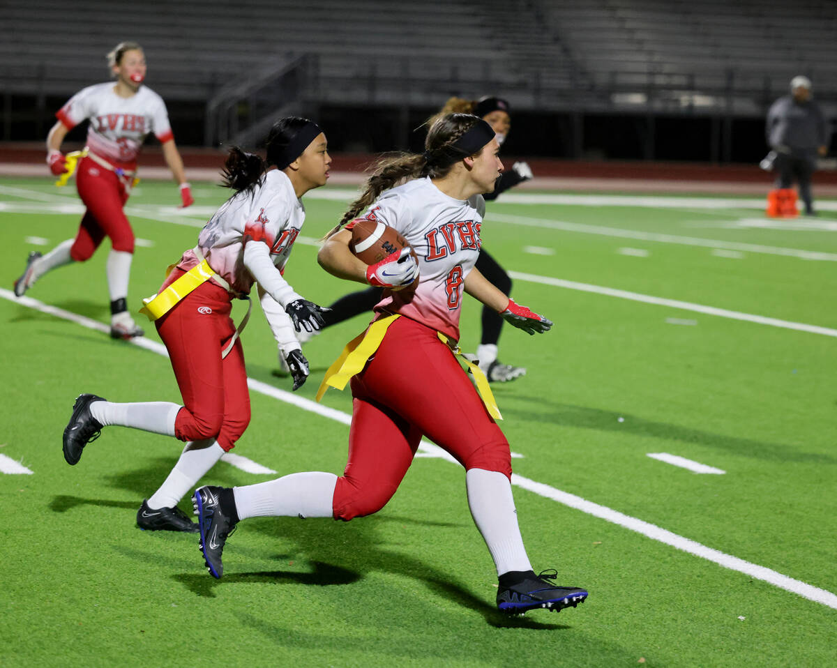 Las Vegas’ Kellsie Littlewood (8) runs the ball after intercepting a Desert Oasis pass i ...