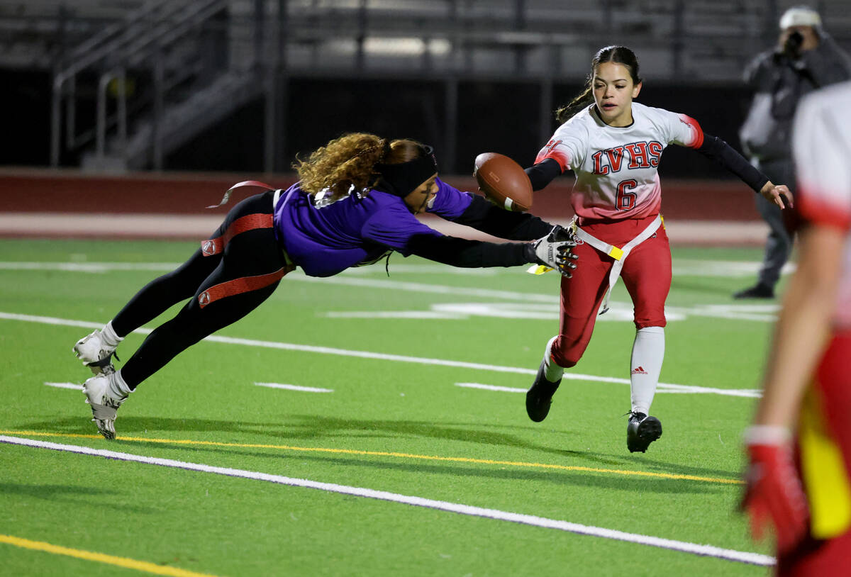 Las Vegas High School quarterback Sarah Pasquali (6) runs past Desert Oasis defender Brooklin H ...