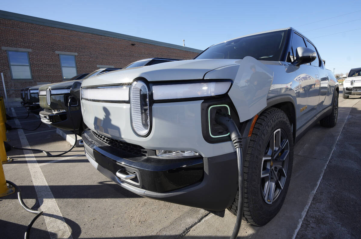 A 2023 R1T pickup truck is charged in a bay at a Rivian delivery and service center Wednesday, ...