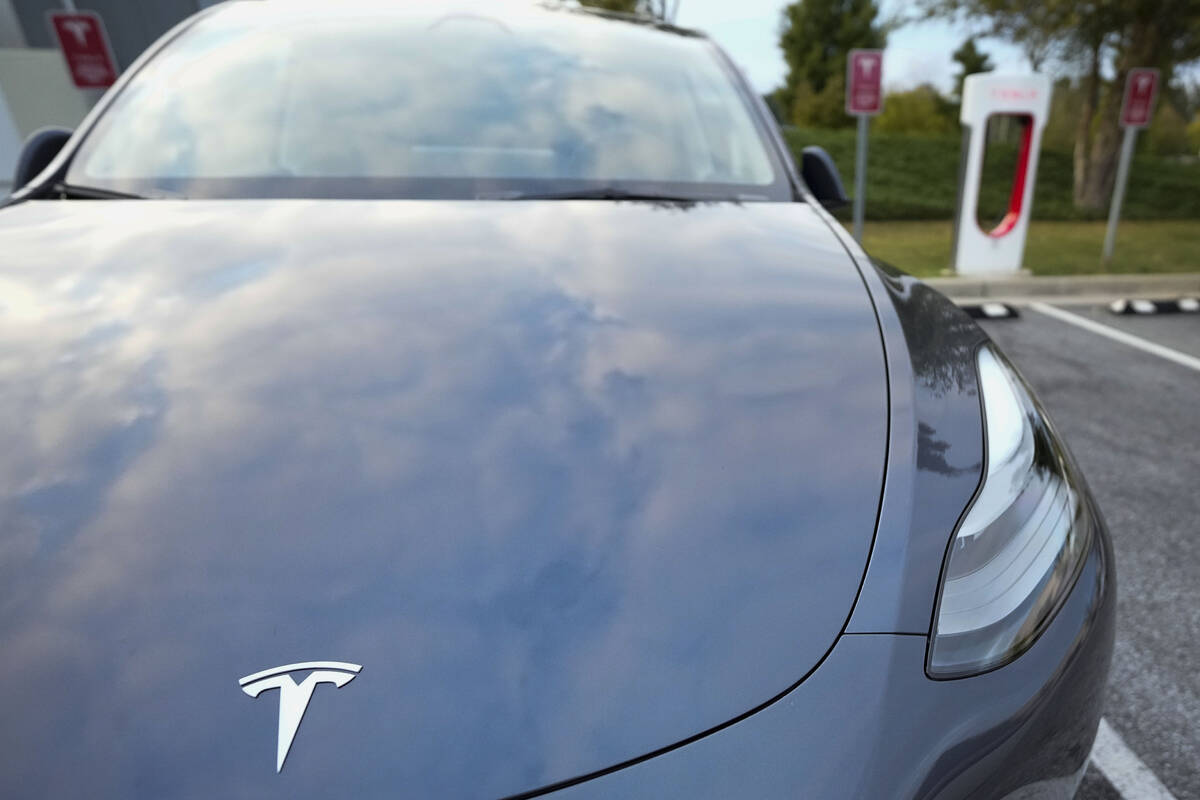 A Tesla Model Y Long Range charges, Sept. 27, 2023, in Woodstock, Ga. Government tallies show o ...