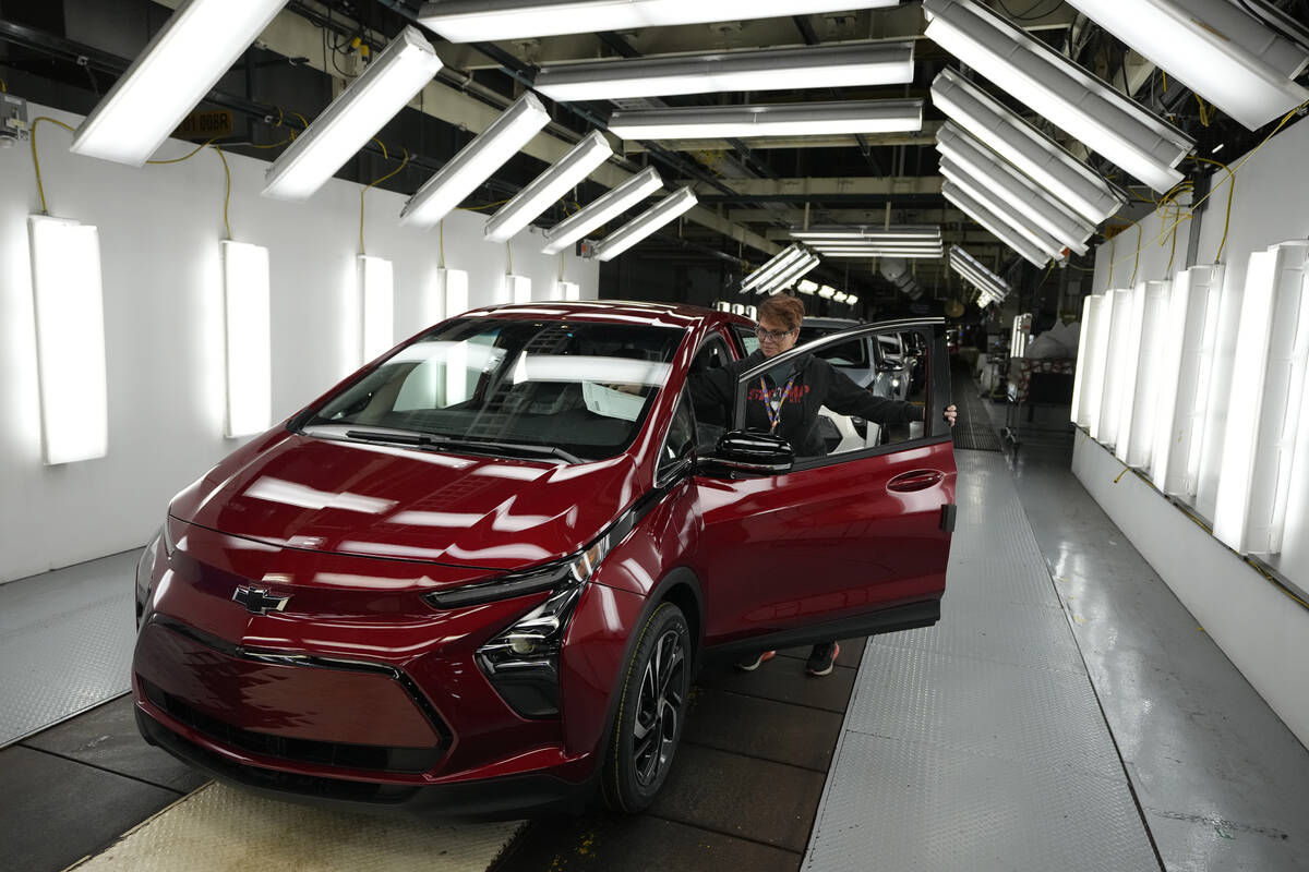 Assembly line worker Janice DeBono looks over a 2023 Chevrolet Bolt EUV at the General Motors O ...