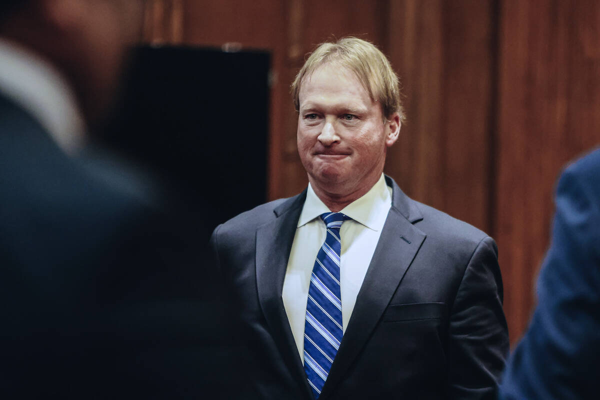 Jon Gruden leaves court after appearing at a hearing for oral arguments in a legal fight betwee ...