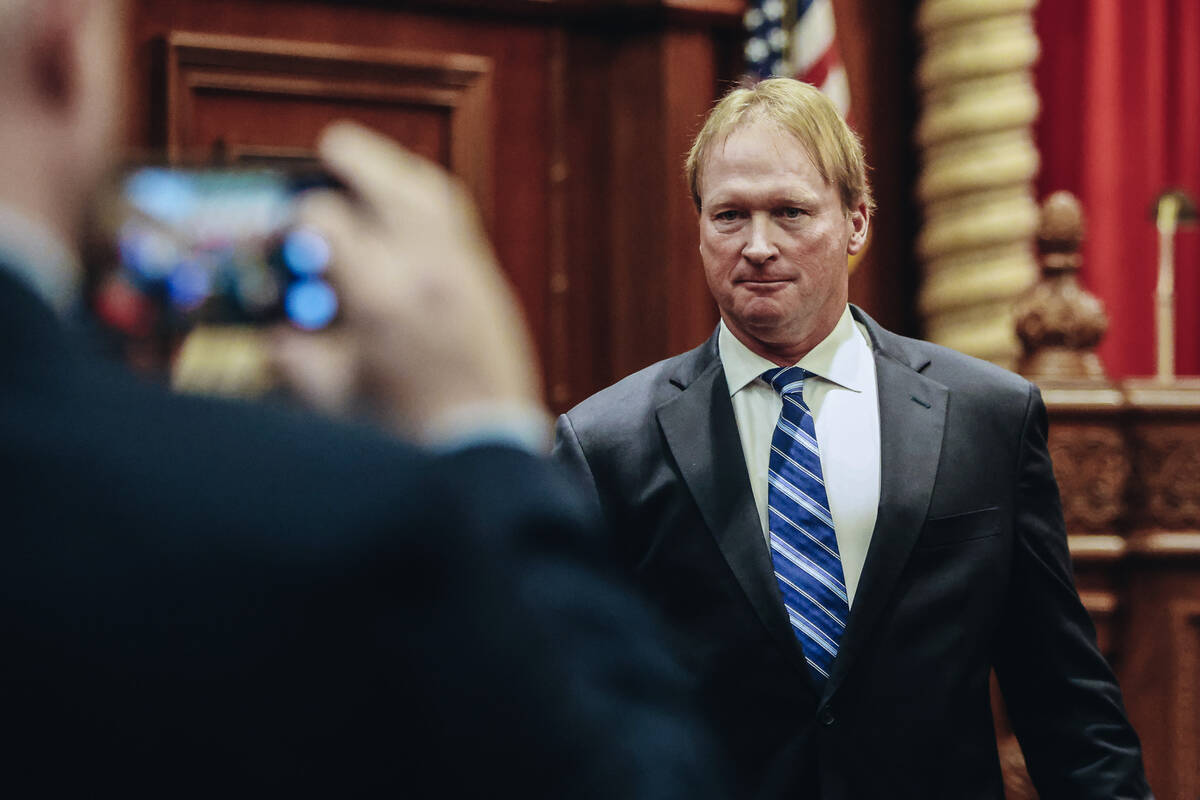 Jon Gruden leaves court after appearing at a hearing for oral arguments in a legal fight betwee ...