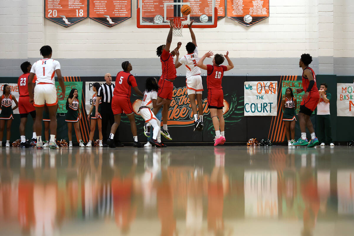 Mojave guard C.J. Shaw (3) shoots against Coronado center Tee Bartlett (13) during the second h ...