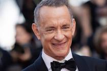 Tom Hanks poses for photographers upon arrival at the premiere of the film 'Asteroid City' at t ...