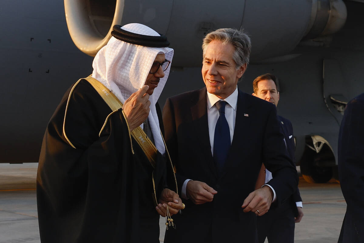 U.S. Secretary of State Antony Blinken, right, walks with Bahrain's Foreign Minister Abdullatif ...
