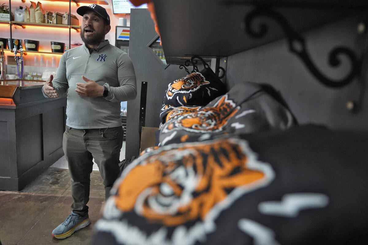 Roberto Torres, owner of the Blind Tiger Cafe gestures during an interview Wednesday, Jan. 10, ...