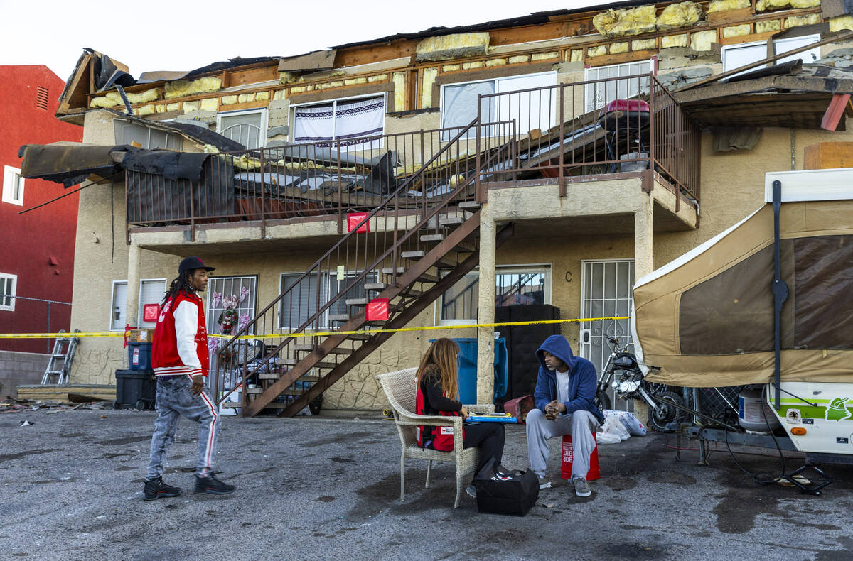 The Red Cross assists those displaced by an apartment building roof collapse near Carey Avenue ...