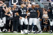 Raiders quarterback Jimmy Garoppolo (10) stands on the sideline during an NFL football game aga ...