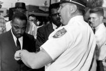 FILE - In this July 27, 1962, file photo, the Rev. Dr. Martin Luther King, Jr., is arrested by ...