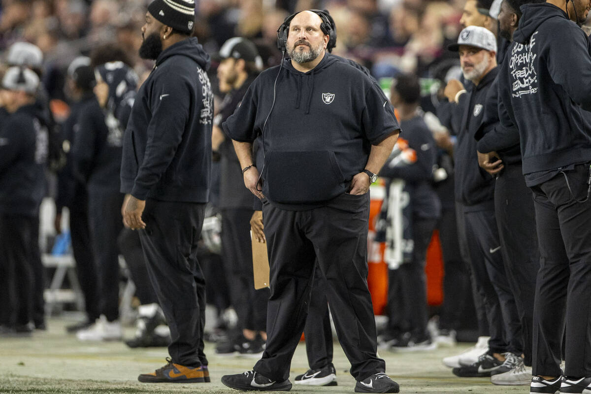 Raiders offensive line coach Carmen Bricillo looks on during the first half of an NFL game agai ...