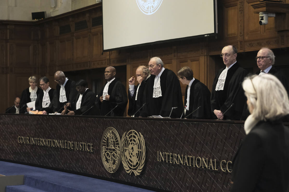Judges Israel's Aharon Barak, center right, and South Africa's Dikgang Ernest Moseneke, center ...