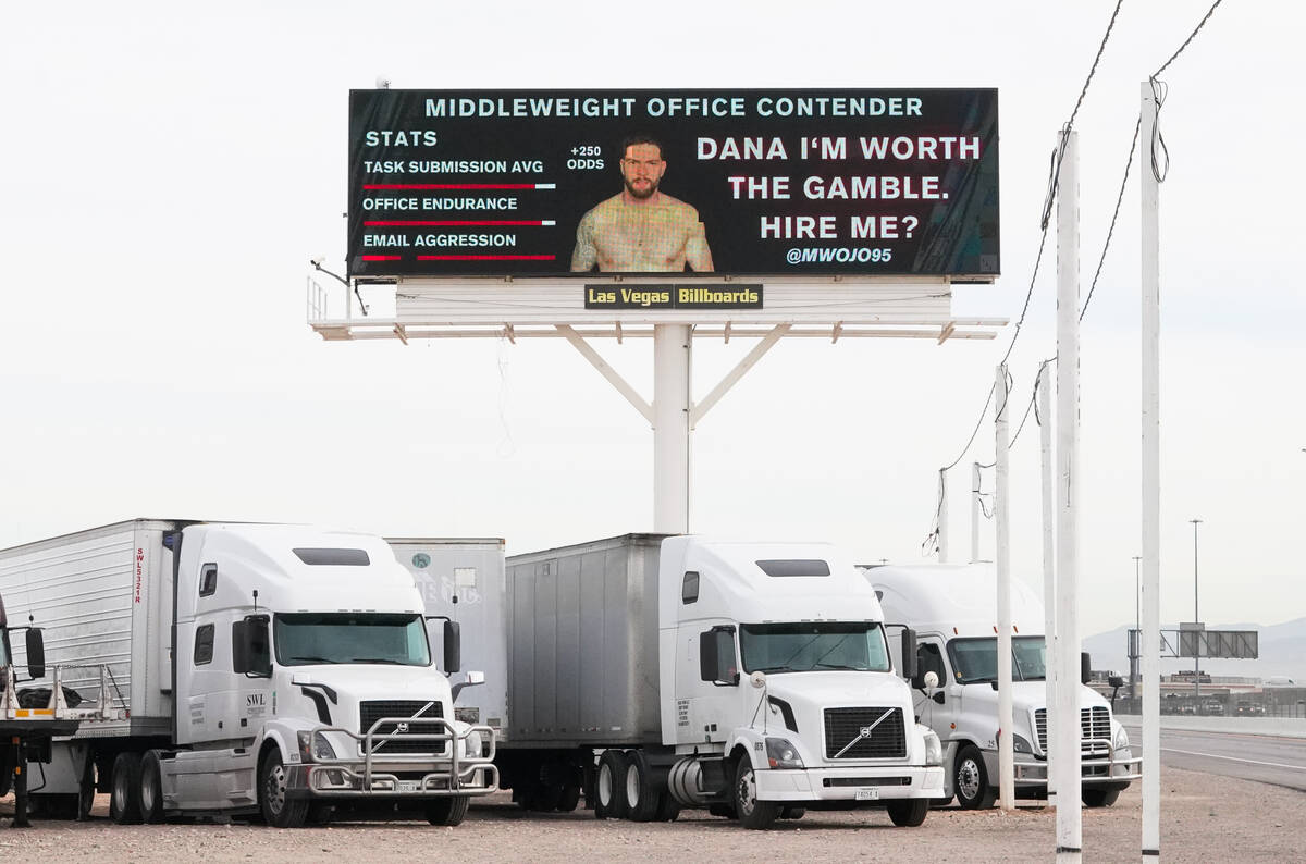 A photo and resume for Michael Wojo of Ontario, Canada, is displayed on a digital billboard out ...