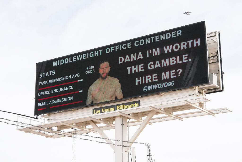 A photo and resume for Michael Wojo of Ontario, Canada, is displayed on a digital billboard out ...