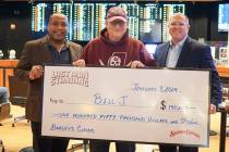 Las Vegas resident Bill Jensen (center) is presented with a check for $150,000 for winning Stat ...