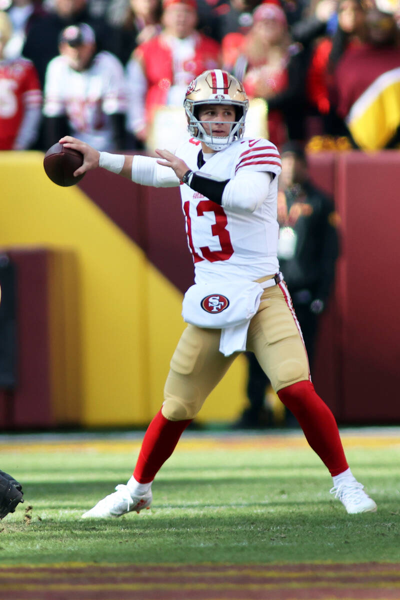 San Francisco 49ers quarterback Brock Purdy (13) throws during an NFL football game against the ...