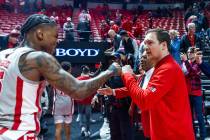 UNLV guard Luis Rodriguez (15) is congratulated by head coach Kevin Kruger following the second ...