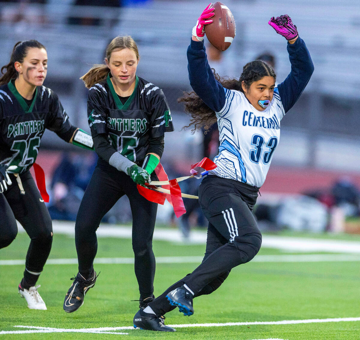 Centennial receiver Ana Cruz (33) has her flag pulled by Palo Verde Alexis Manzo (15) during th ...