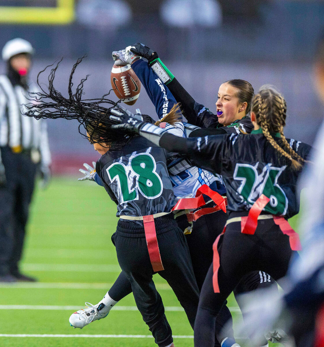 Palo Verde defender Madison Miller (28) and teammates break up a pass to Centennial receiver As ...