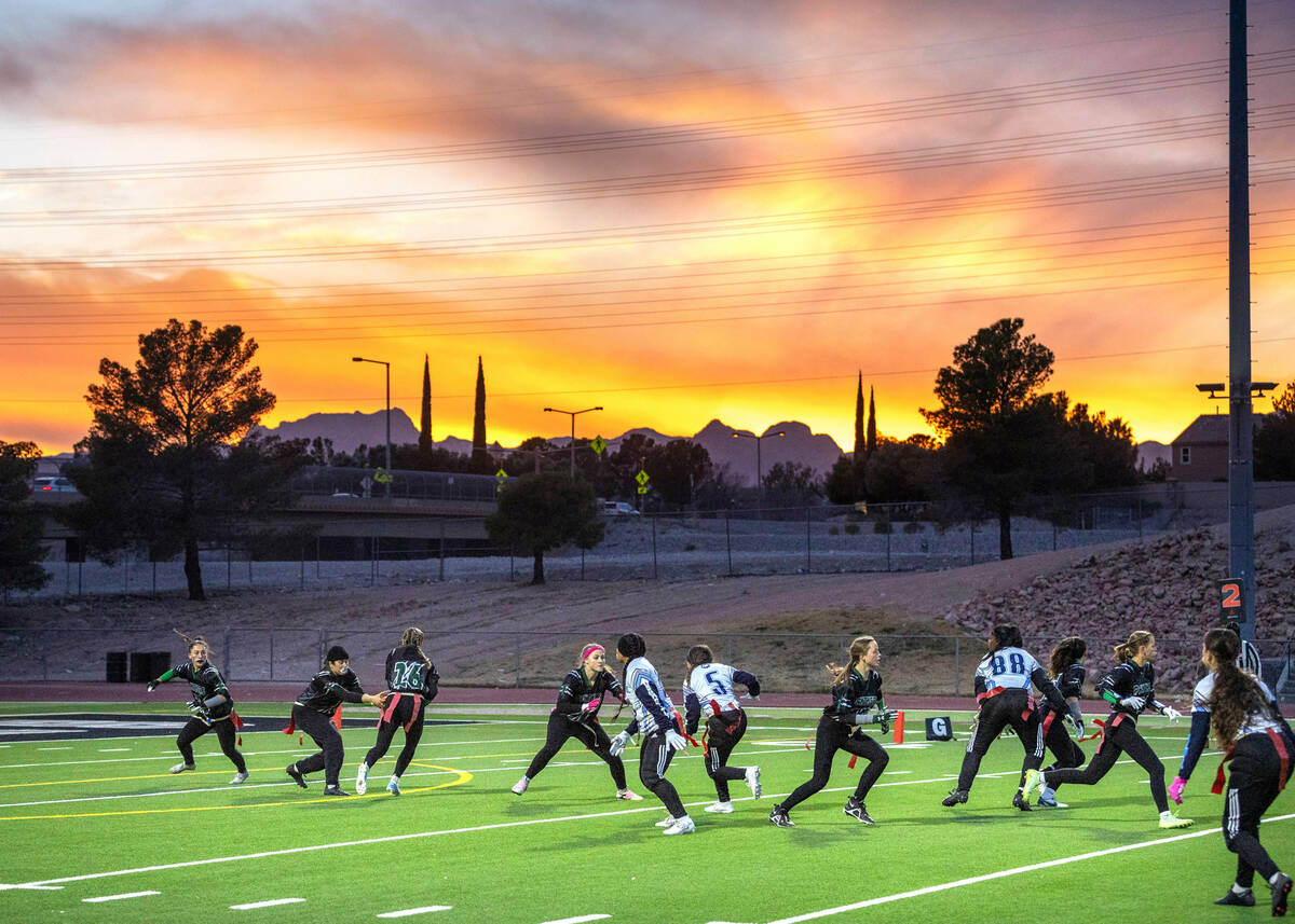 A blazing sunset is backdrop as Palo Verde drives against Centennial during the first half of t ...