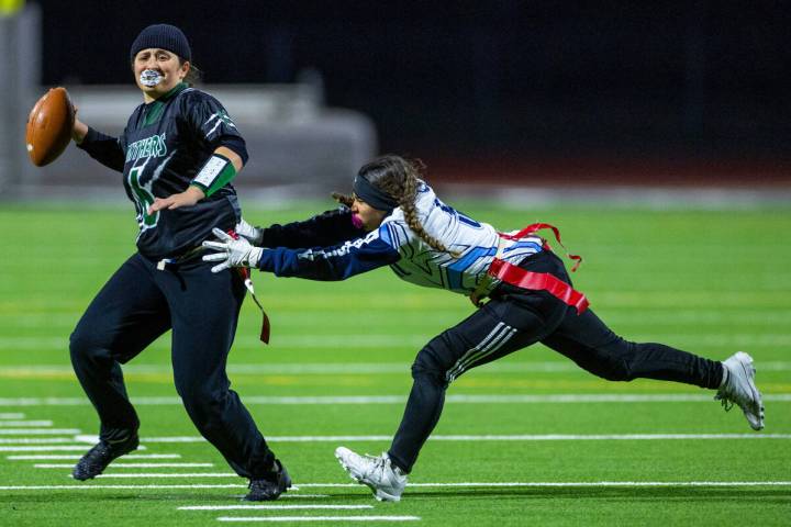 Palo Verde quarterback Jordan Katz (6) looks to pass as Centennial defender Vari Rua (5) closes ...