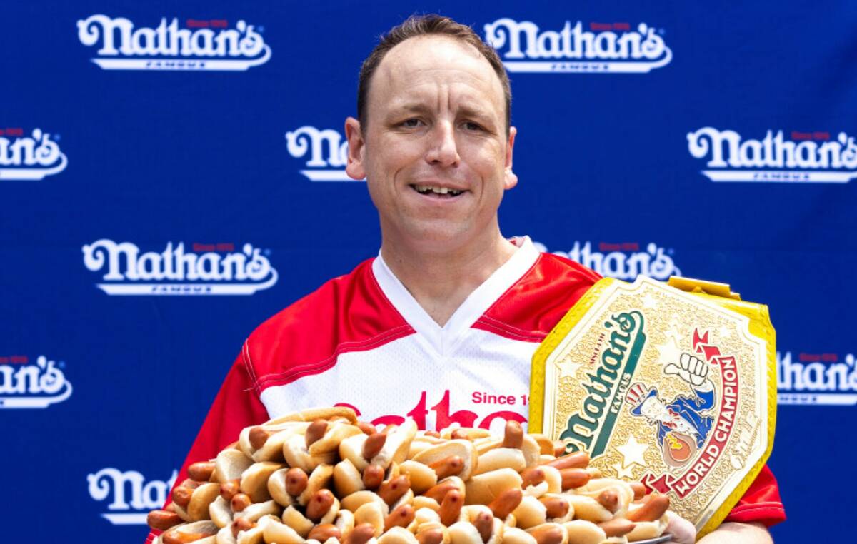 Joey Chestnut poses for photos before the Nathan's Famous July Fourth hot dog eating contest, F ...