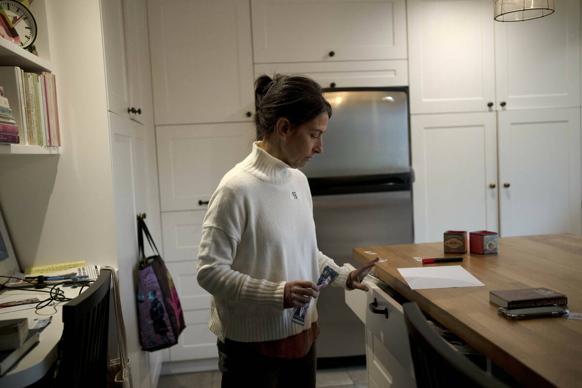 Rachel Goldberg-Polin holds a photo of her son, Hersh Goldberg-Polin on day 98 since he was kid ...