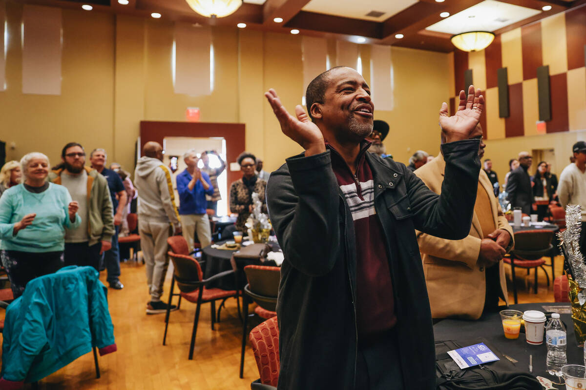 A worshipper sings and claps their hands during the Citywide Unity Prayer Celebration at the Hi ...