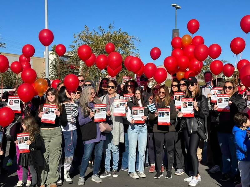 People walked in downtown Summerlin in west Las Vegas on Sunday, Jan. 14, 2024 to mark 100 days ...