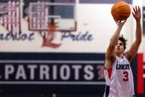 Liberty guard Kaeden Castillero (3) shoots the final free throws of a boys high school basketba ...