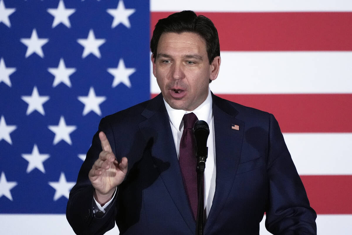 Republican presidential candidate Florida Gov. Ron DeSantis speaks to supporters during a caucu ...