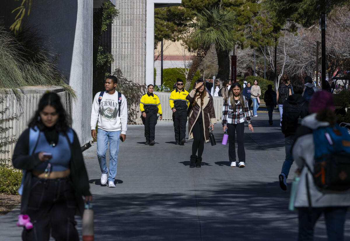 Security personnel patrol campus as students return for classes following the shooting at UNLV ...