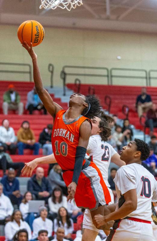 Bishop Gorman guard Nick Jefferson (10) gets inside for a shot over Arbor View guard Trammell D ...