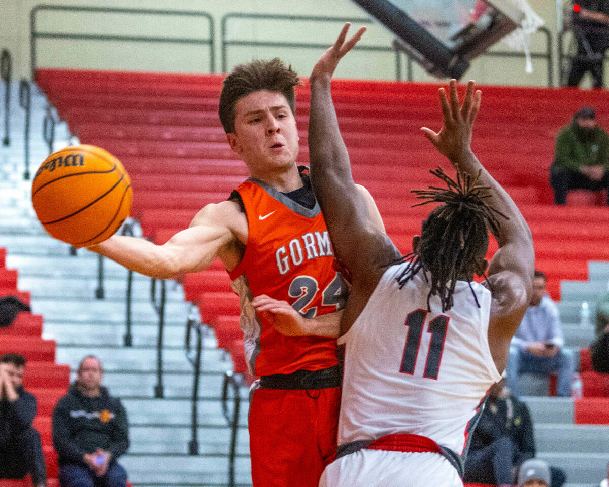 Bishop Gorman guard Ryder Elisaldez (24) looks to pass around Arbor View forward Brian “ ...