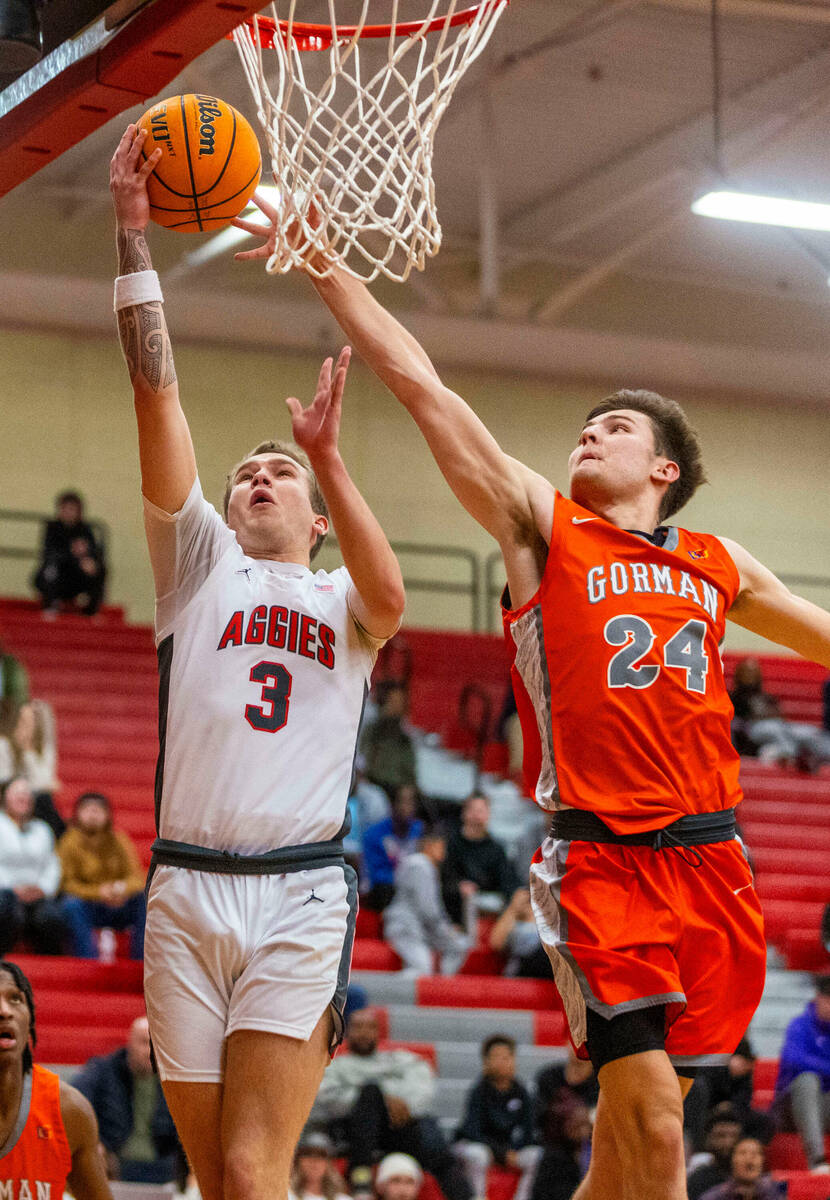 Arbor View guard Jalen Dickel (3) beats Bishop Gorman guard Ryder Elisaldez (24) to a lay up du ...