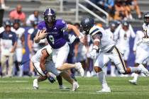 Holy Cross Crusaders quarterback Matthew Sluka (9) runs with the ball during a college football ...