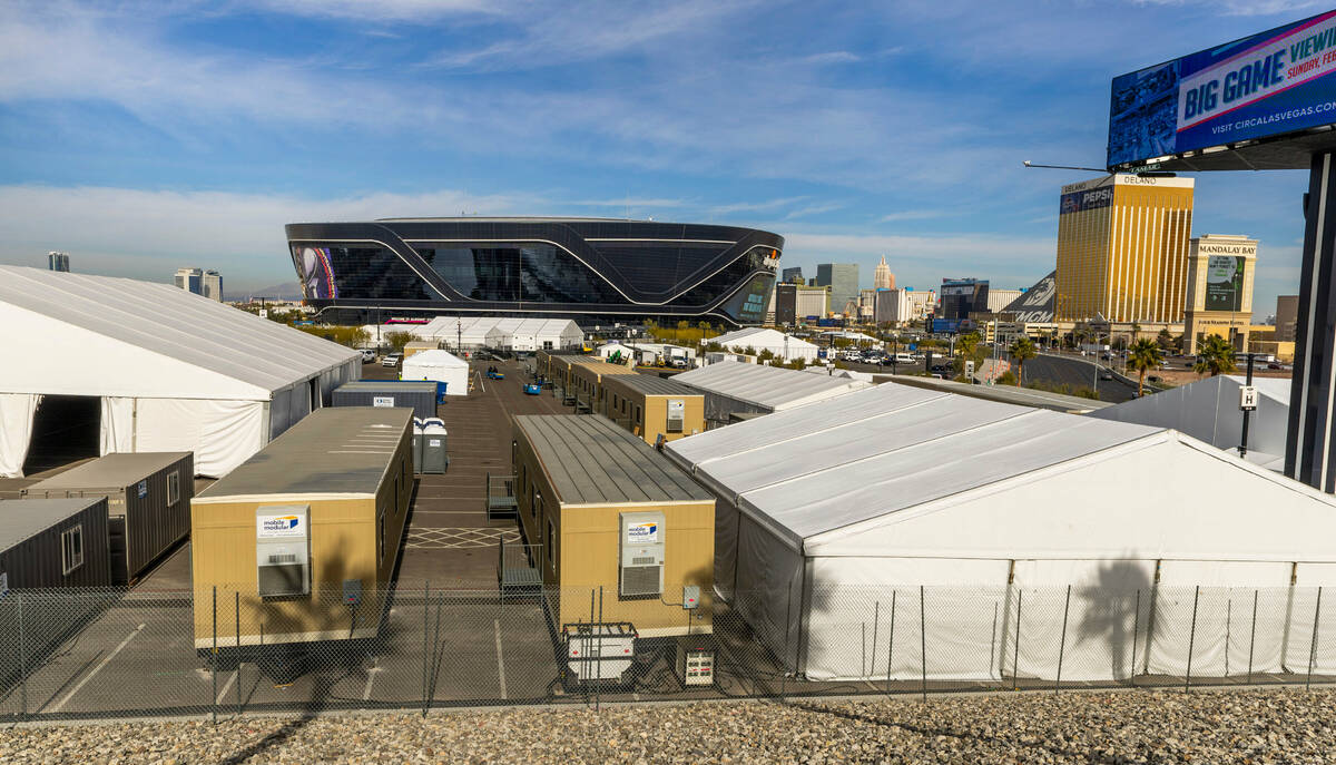 Tents are erected and equipment stored in parking lots as Super Bowl preparations continue at A ...