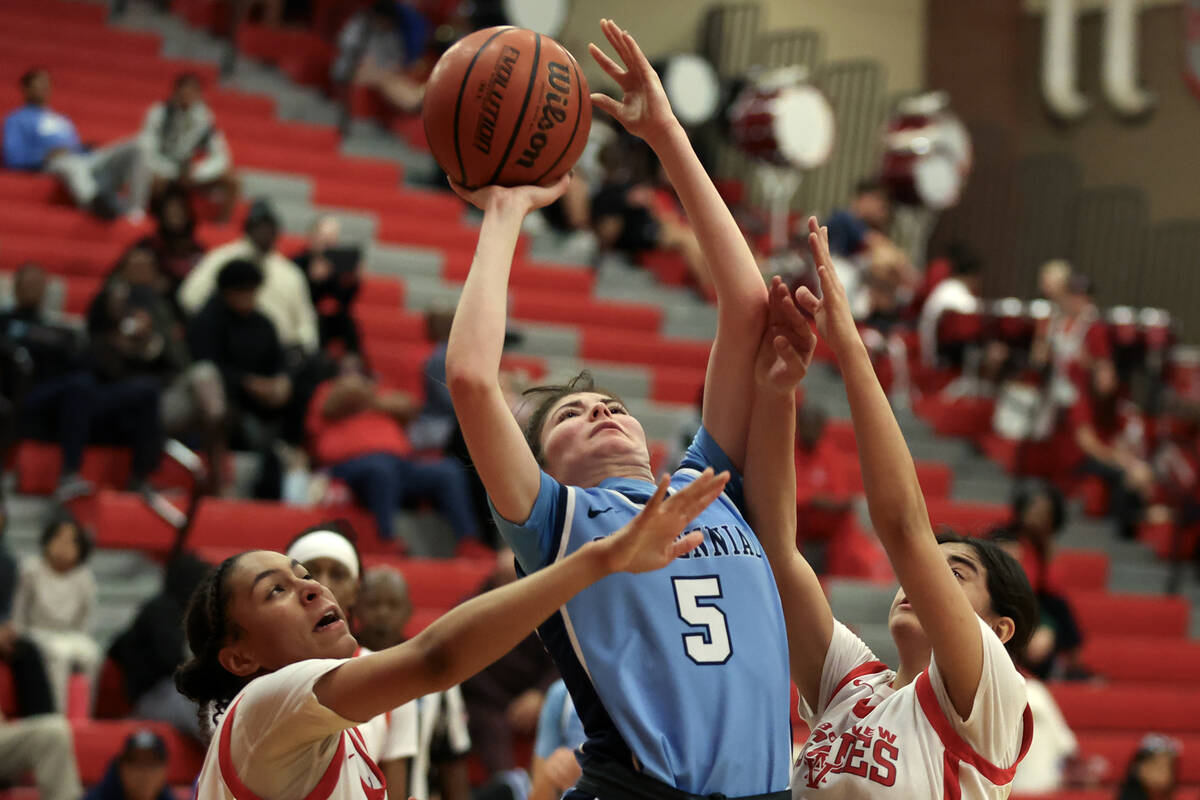 Centennial's Trysta Barrett (5) shoots against Arbor View's Aliyah Gantz (2) and Arianna Vera ( ...