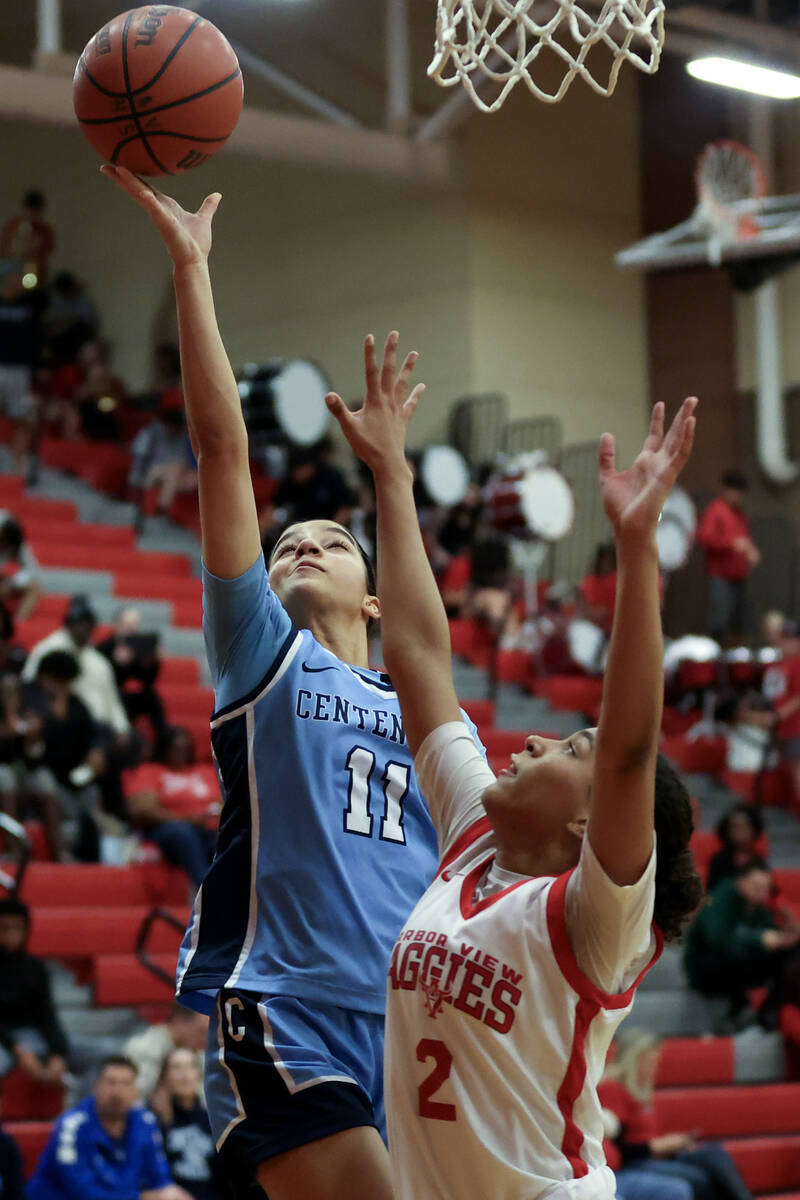 Centennial's Danae Powell (11) shoots against Arbor View's Aliyah Gantz (2) during the second h ...