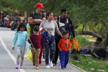 Migrants arrive to the Mexican side of the bank of the Rio Grande river in Matamoros, Mexico. ( ...