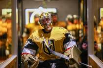 Golden Knights goaltender Logan Thompson heads to the ice for warmups before an NHL hockey game ...