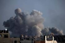 Smoke rises following Israeli bombardments in Khan Younis, southern Gaza Strip, Wednesday, Jan. ...