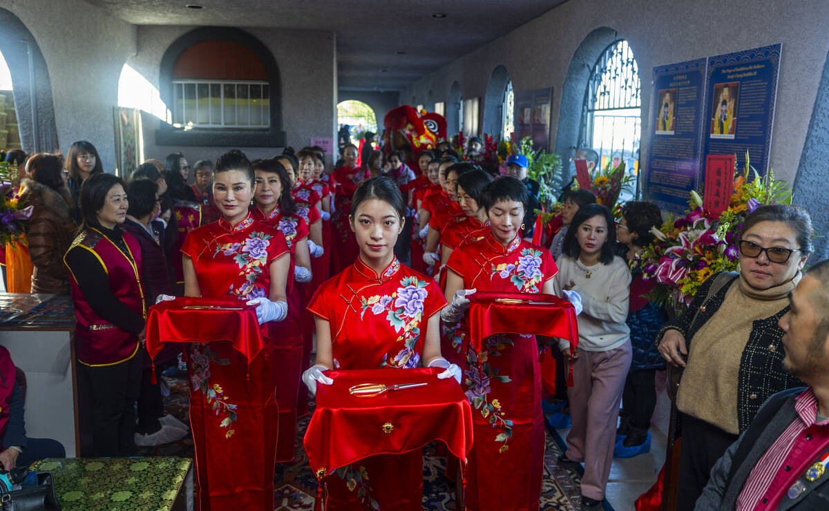 The scissors for a ribbon cutting are marched in during the opening ceremony of the Benevolence ...