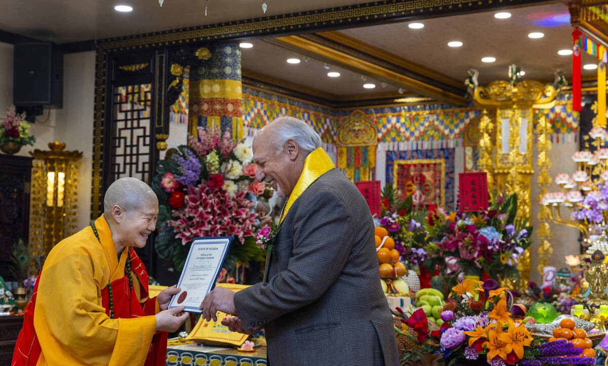 Holy Guru Zhengda Jiaozun is presented with a certificate from Nevada Lieutenant Governor Stavr ...